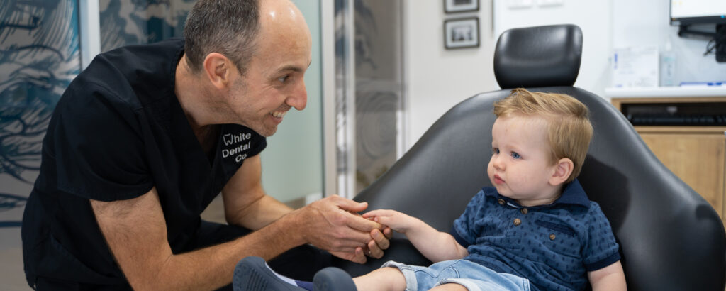 A young patient in a dental chair