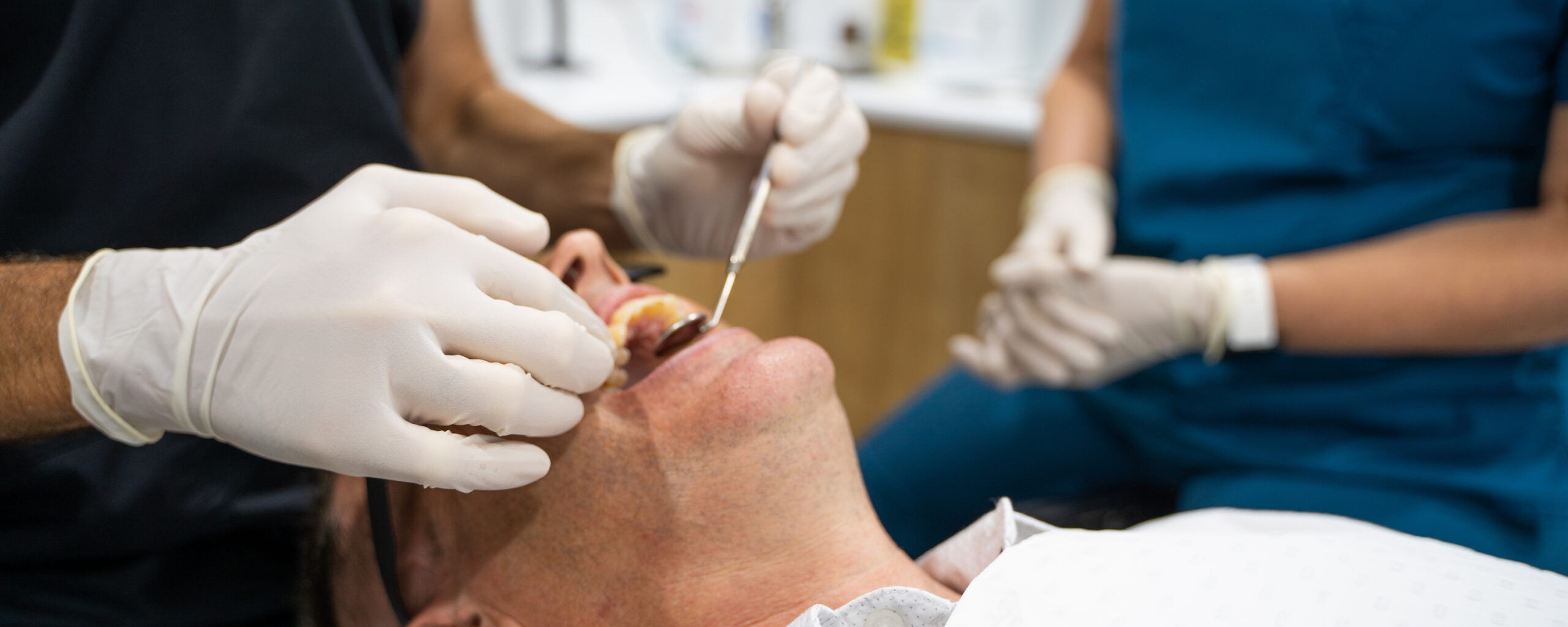 A close-up of a patient during a dental check-up appointment at White Dental Co.