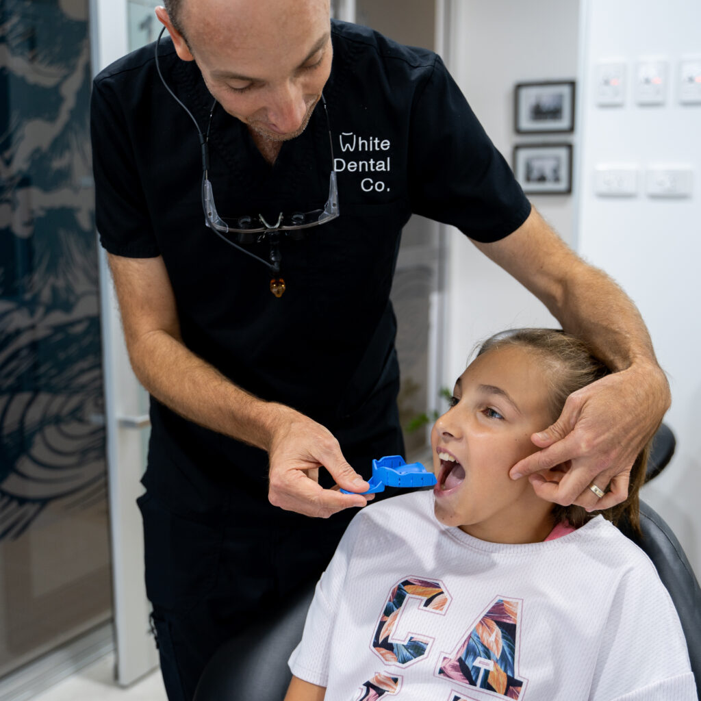 Dr Nick prepares a young patient for an impression for a sports mouthguard